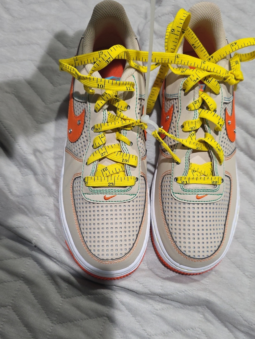 Nike Kids Beige Sneakers with Orange Swoosh and Yellow Laces